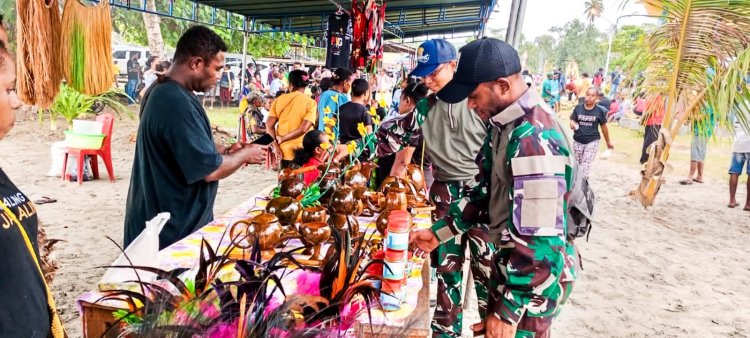 Satgas Pamtas Yonif 122/TS turut Mensukseskan kegiatan Festival Kelapa Ke-2 di Kampung Skouw Yambe Distrik Muaratami